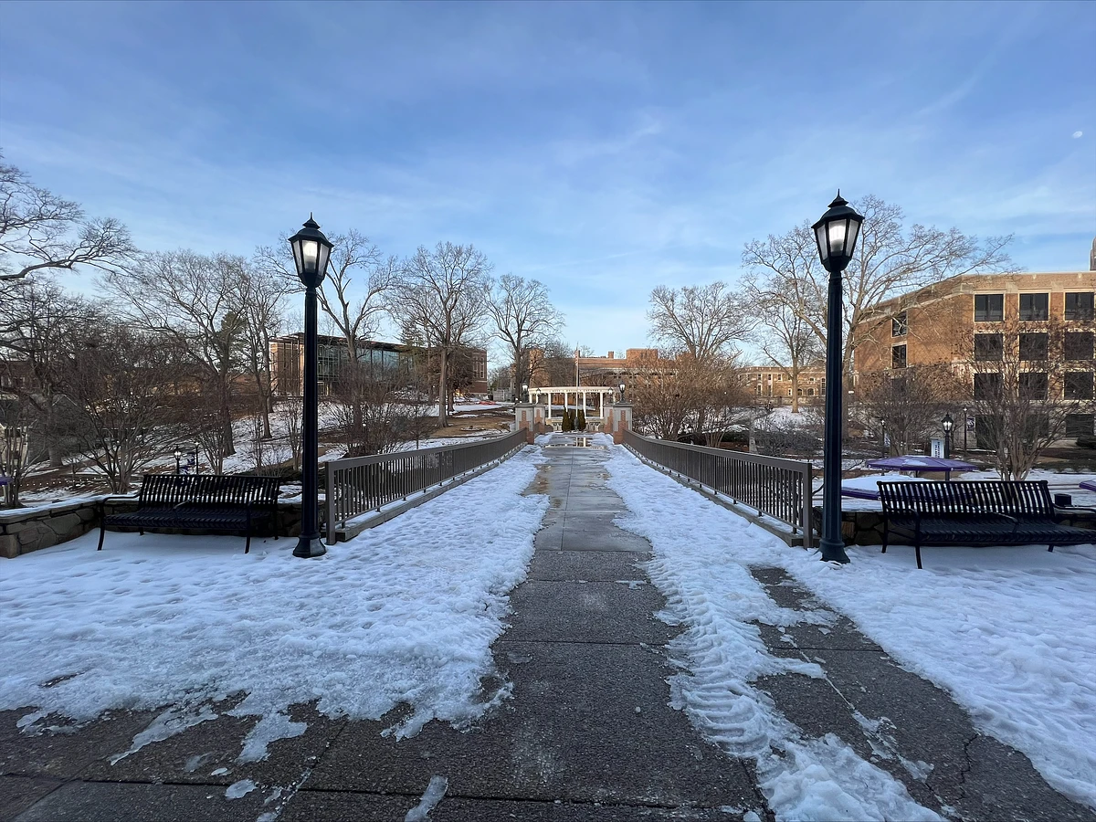The pedestrian bridge at the GUC with snow and ice in 2024 after Facilities worked to clear a path. 